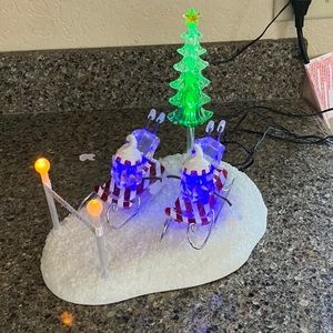 GLOWING LIGHTED ICY SNOWMEN RACING ON SLEDS